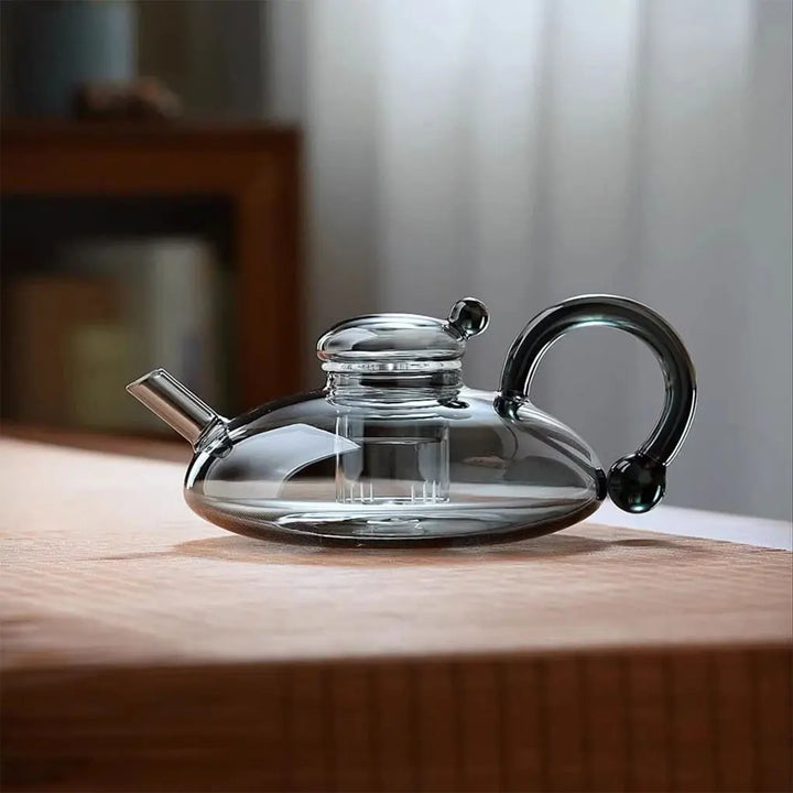 Heat-resistant glass teapot with tea divider