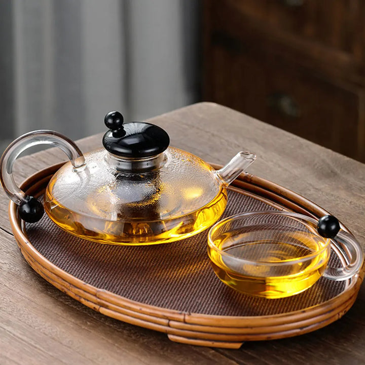 Heat-resistant glass teapot with tea divider