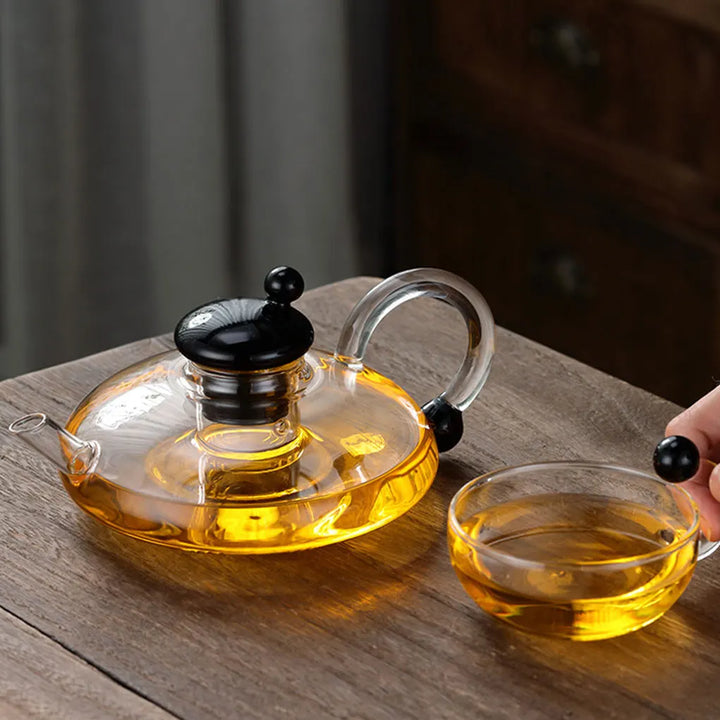Heat-resistant glass teapot with tea divider